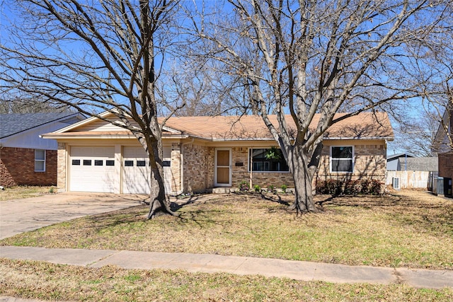 single story home with a front lawn, brick siding, driveway, and an attached garage