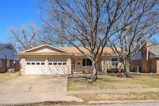 ranch-style home featuring brick siding, driveway, an attached garage, and central AC unit