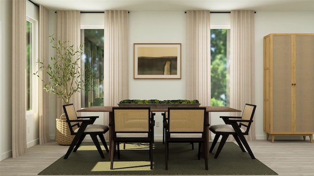 dining room with breakfast area, light wood-type flooring, and baseboards