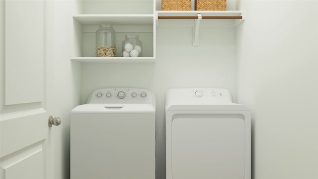 washroom with laundry area and washing machine and dryer