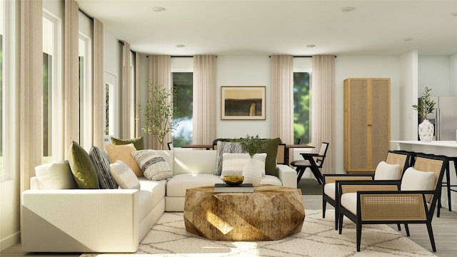 living area featuring plenty of natural light and wood finished floors