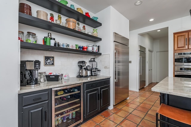 bar with a dry bar, decorative backsplash, wine cooler, stainless steel appliances, and recessed lighting