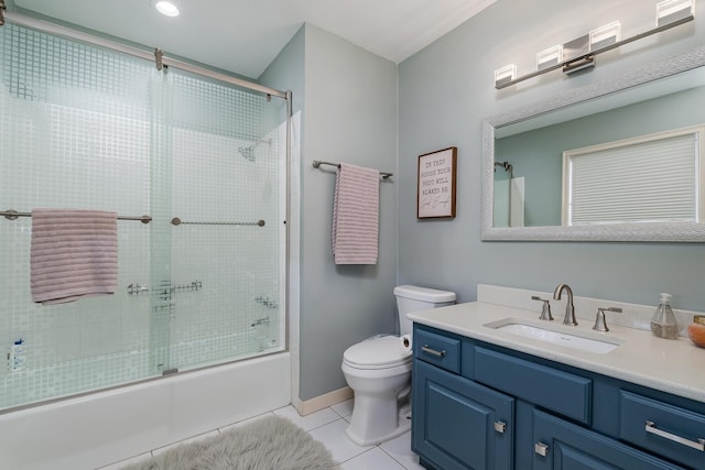 full bathroom with tile patterned flooring, combined bath / shower with glass door, vanity, and toilet