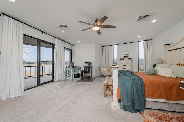 carpeted bedroom featuring recessed lighting, visible vents, and access to exterior