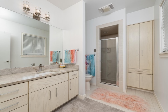 bathroom with visible vents, toilet, tile patterned flooring, vanity, and a shower stall