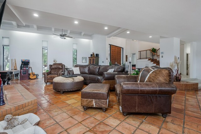 living area with ceiling fan, stairway, beam ceiling, and recessed lighting