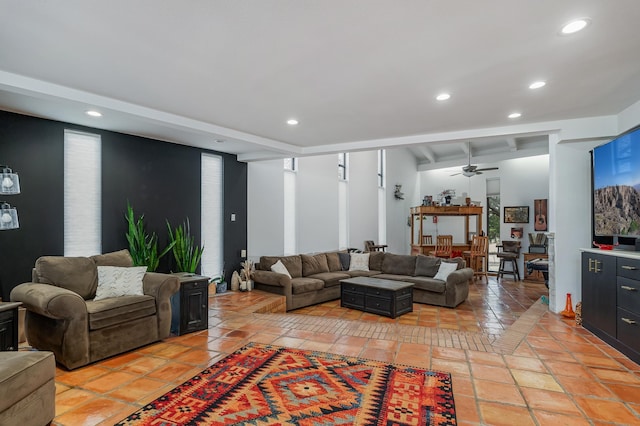 living area featuring light tile patterned flooring, a ceiling fan, and recessed lighting