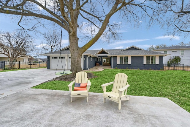 view of front of house with concrete driveway, a front lawn, an attached garage, and fence