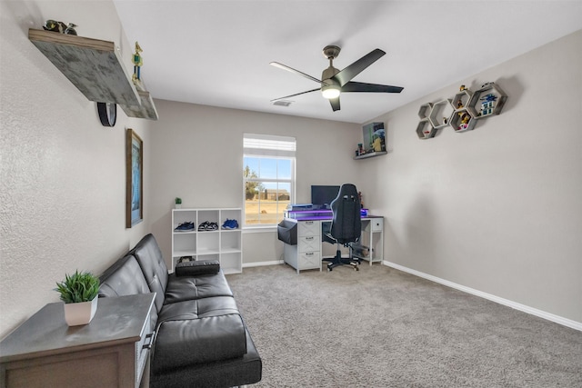 carpeted office with visible vents, ceiling fan, and baseboards