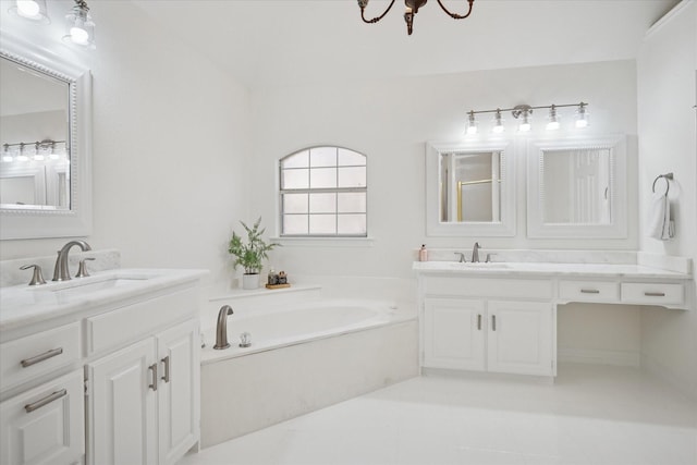 bathroom with two vanities, a garden tub, a sink, and tile patterned floors