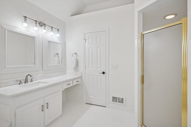 bathroom with a stall shower, visible vents, vaulted ceiling, and vanity