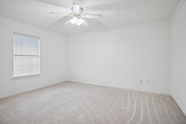 unfurnished room with light carpet, crown molding, baseboards, and ceiling fan