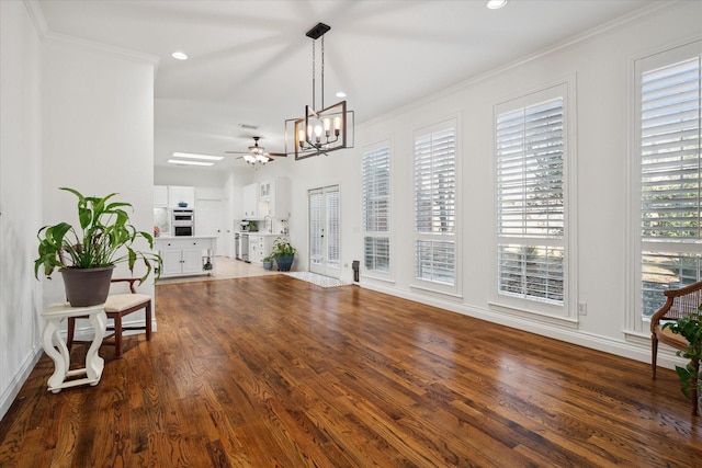 interior space with recessed lighting, crown molding, and wood finished floors