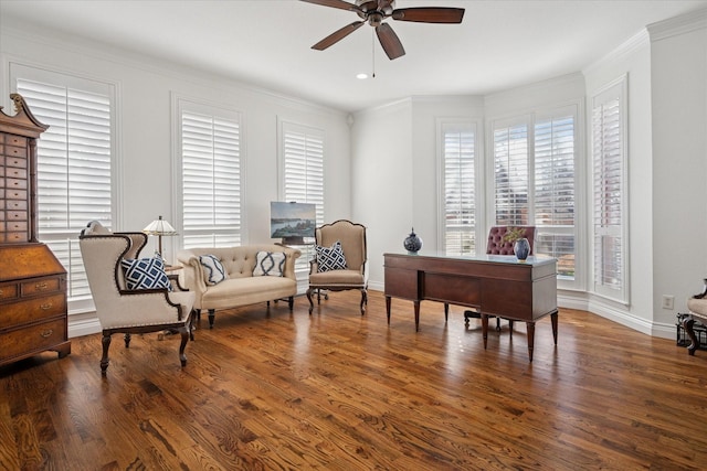 home office with crown molding, baseboards, ceiling fan, and wood finished floors