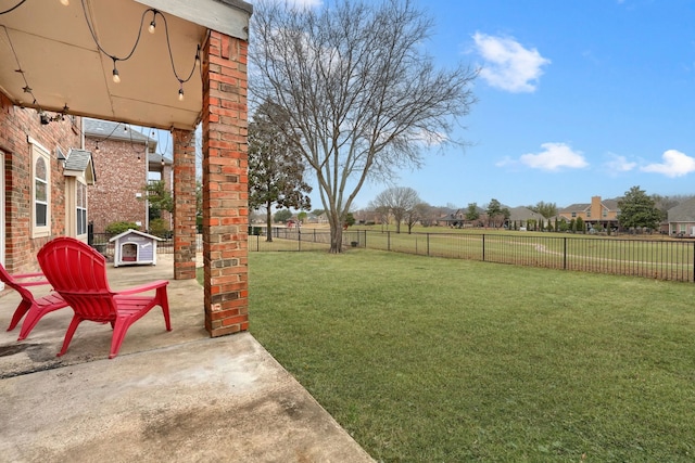 view of yard with a fenced backyard and a patio