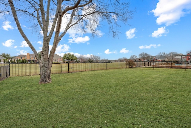 view of yard featuring a residential view and a fenced backyard