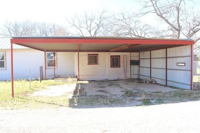 exterior space featuring a carport