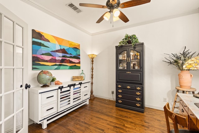 interior space with visible vents, baseboards, dark wood-style floors, ceiling fan, and crown molding