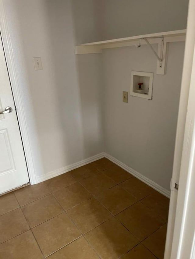 washroom featuring baseboards, laundry area, hookup for a washing machine, and tile patterned floors