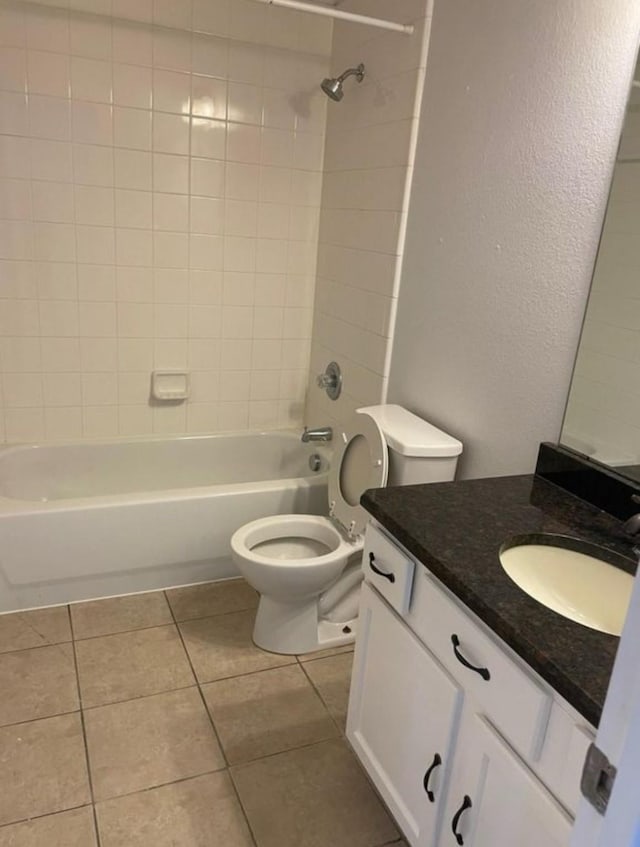 bathroom with toilet, tile patterned flooring, bathtub / shower combination, and vanity