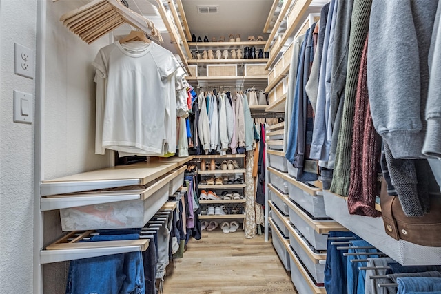 spacious closet with visible vents and wood finished floors