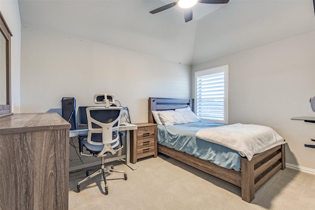 carpeted bedroom featuring ceiling fan, baseboards, and vaulted ceiling