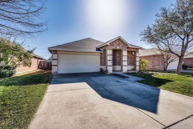 ranch-style house featuring a garage, driveway, a shingled roof, brick siding, and a front yard