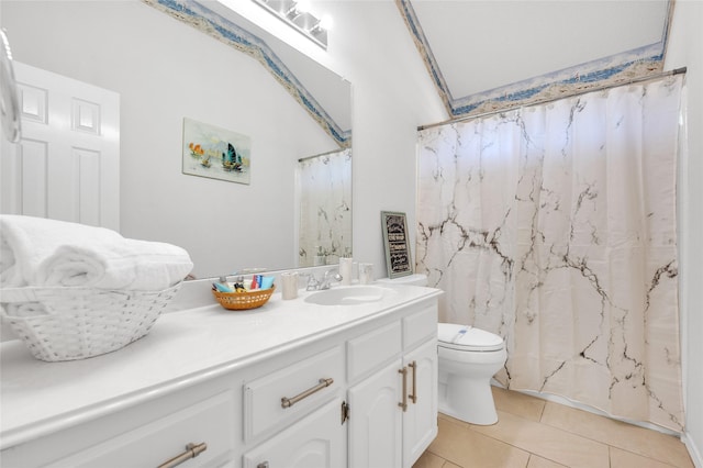 bathroom featuring curtained shower, vanity, toilet, and tile patterned floors