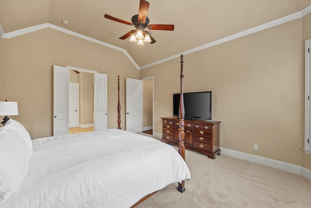 bedroom featuring light carpet, a ceiling fan, baseboards, vaulted ceiling, and ornamental molding