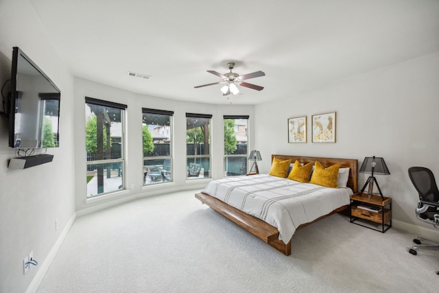 bedroom with a ceiling fan, carpet, visible vents, and baseboards