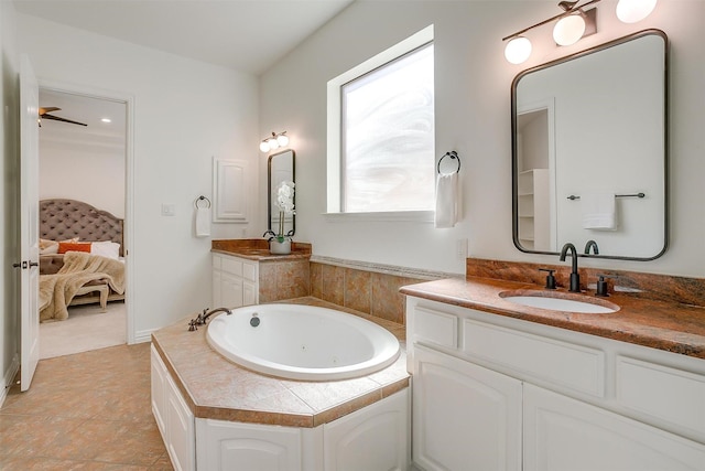 ensuite bathroom with vanity, a whirlpool tub, and ensuite bathroom