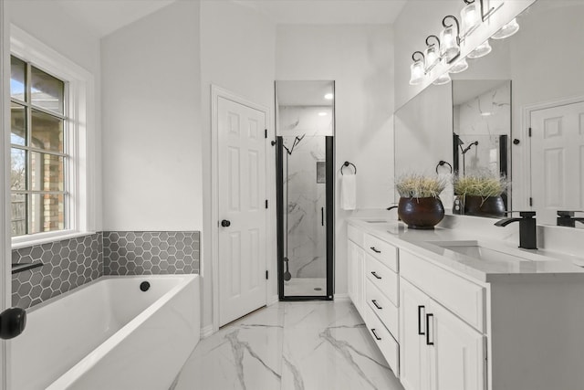 bathroom with a garden tub, a marble finish shower, marble finish floor, and a sink