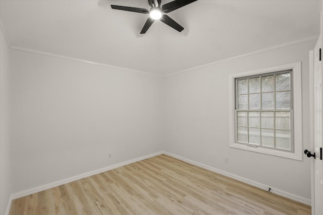 empty room featuring crown molding, ceiling fan, light wood-style flooring, and baseboards