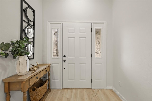 entryway featuring light wood-type flooring and baseboards