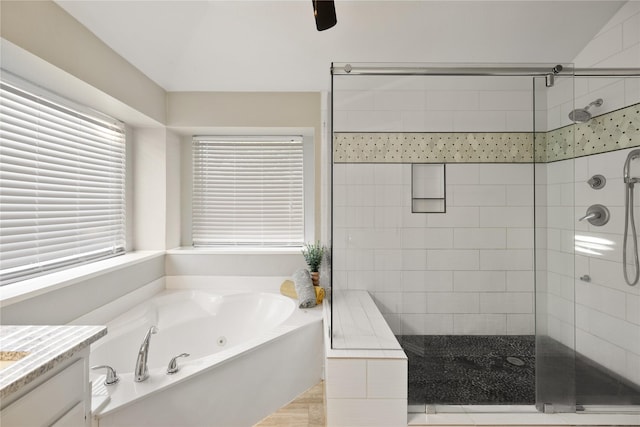 full bathroom with a shower stall, a whirlpool tub, and vanity