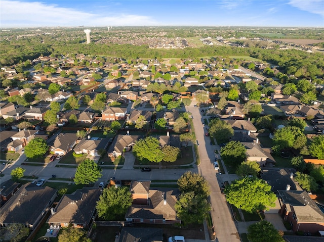 birds eye view of property with a residential view