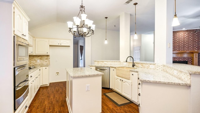 kitchen featuring stainless steel appliances, visible vents, vaulted ceiling, backsplash, and dark wood finished floors