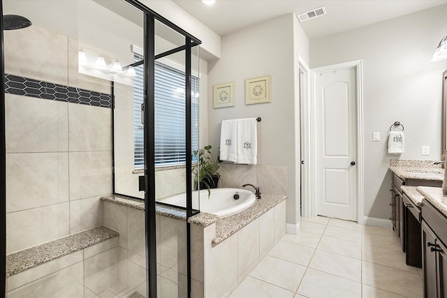 bathroom featuring a garden tub, vanity, visible vents, a shower stall, and tile patterned floors