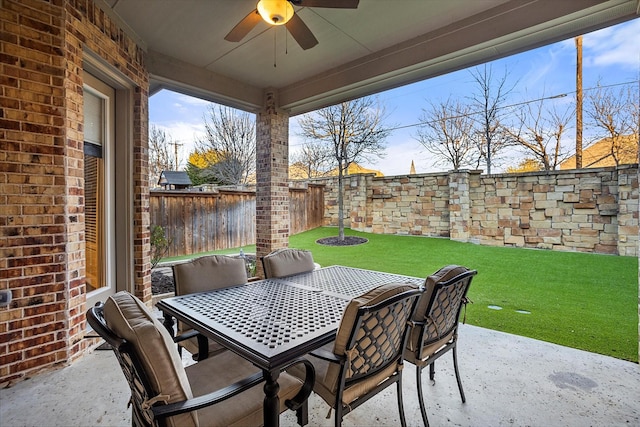 view of patio with ceiling fan, a fenced backyard, and outdoor dining space