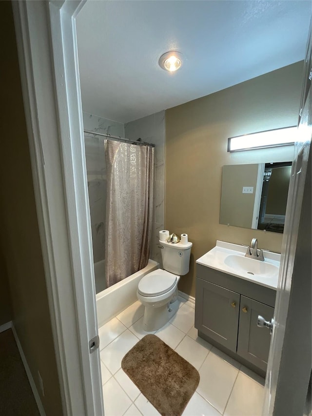 full bathroom with baseboards, toilet, tile patterned floors, shower / bath combination with curtain, and vanity