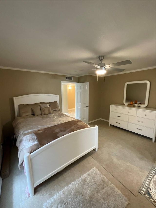 unfurnished bedroom featuring carpet floors, visible vents, crown molding, and a ceiling fan