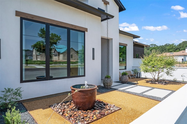 exterior space with stucco siding