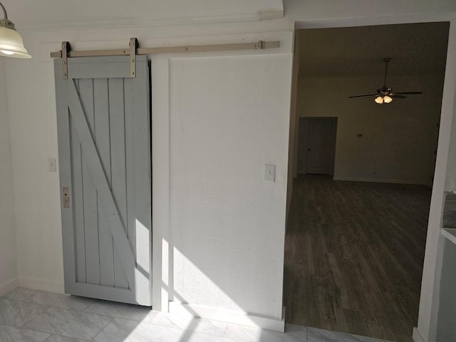 interior space with ceiling fan