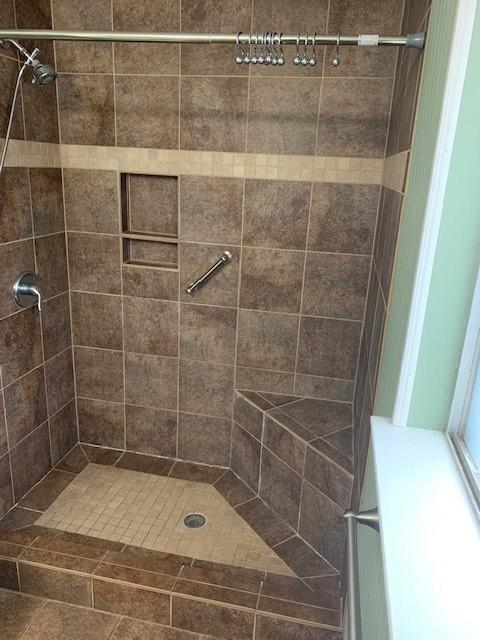 bathroom with a stall shower