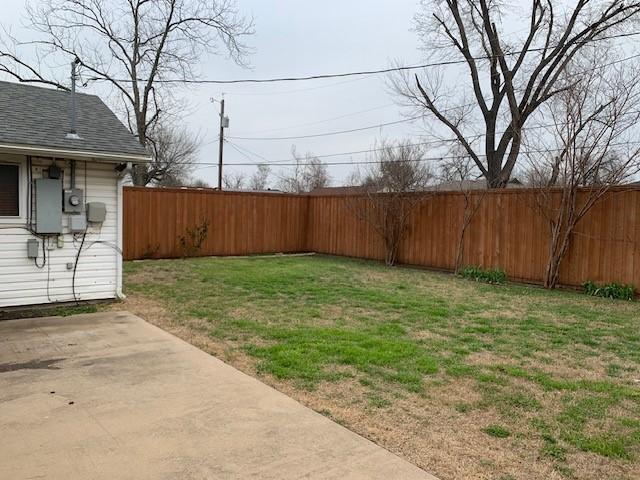 view of yard with a fenced backyard and a patio