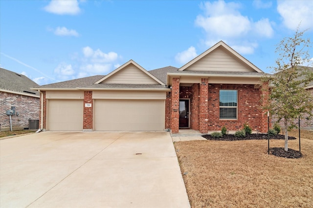 ranch-style home featuring central air condition unit, a garage, brick siding, driveway, and roof with shingles