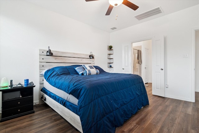 bedroom featuring baseboards, visible vents, ceiling fan, and wood finished floors