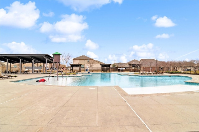 pool featuring a patio and fence