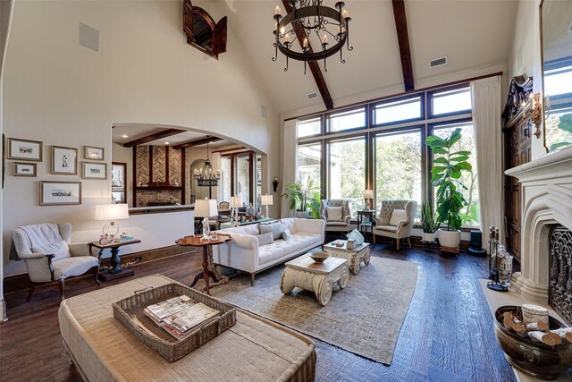 140 Manor Dr, Heath, TX 75032 - living room with a chandelier, high vaulted ceiling, arched walkways, dark wood-style floors, and beamed ceiling