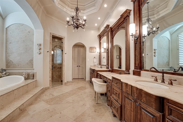 140 Manor Dr, Heath, TX 75032 - bathroom with a chandelier, ornamental molding, a garden tub, a shower stall, and two vanities